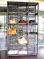Teak showcase with clear acrylic plate and lockable wheels